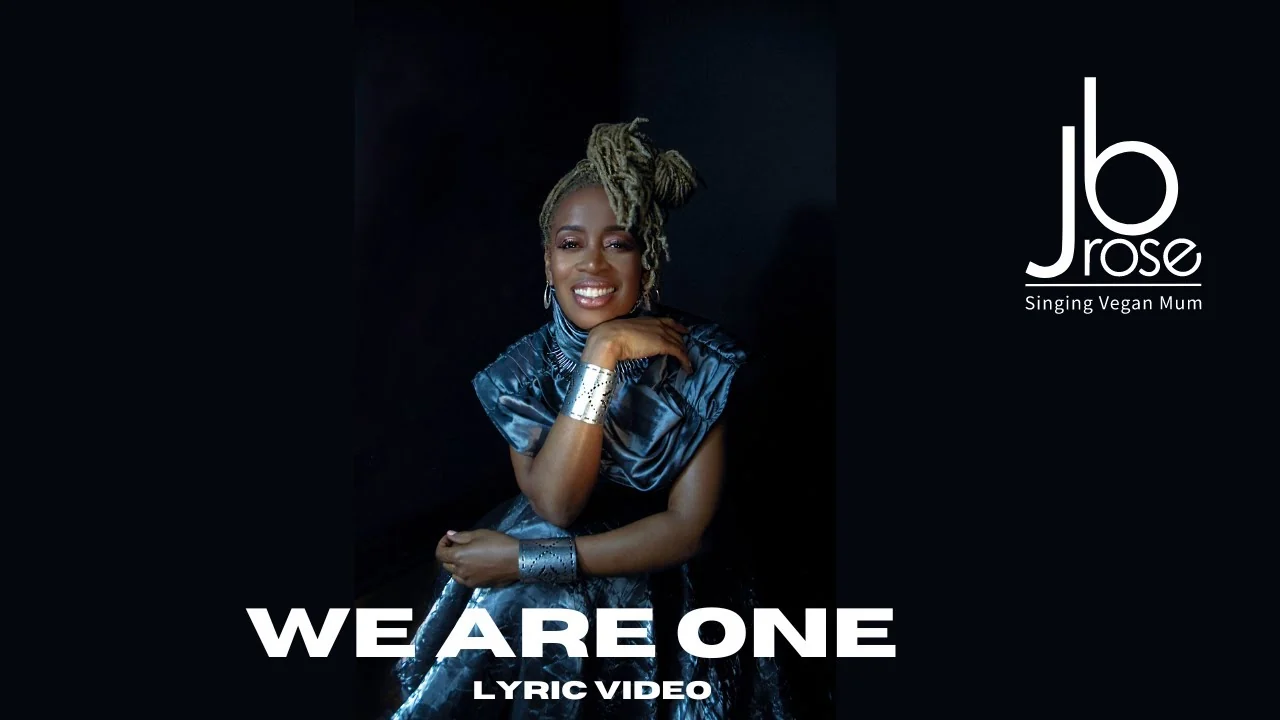 Artwork for the We Are One lyric video, showing JB Rose seated in a blue gown beside the jb rose logo and the words Singing Vegan Mum